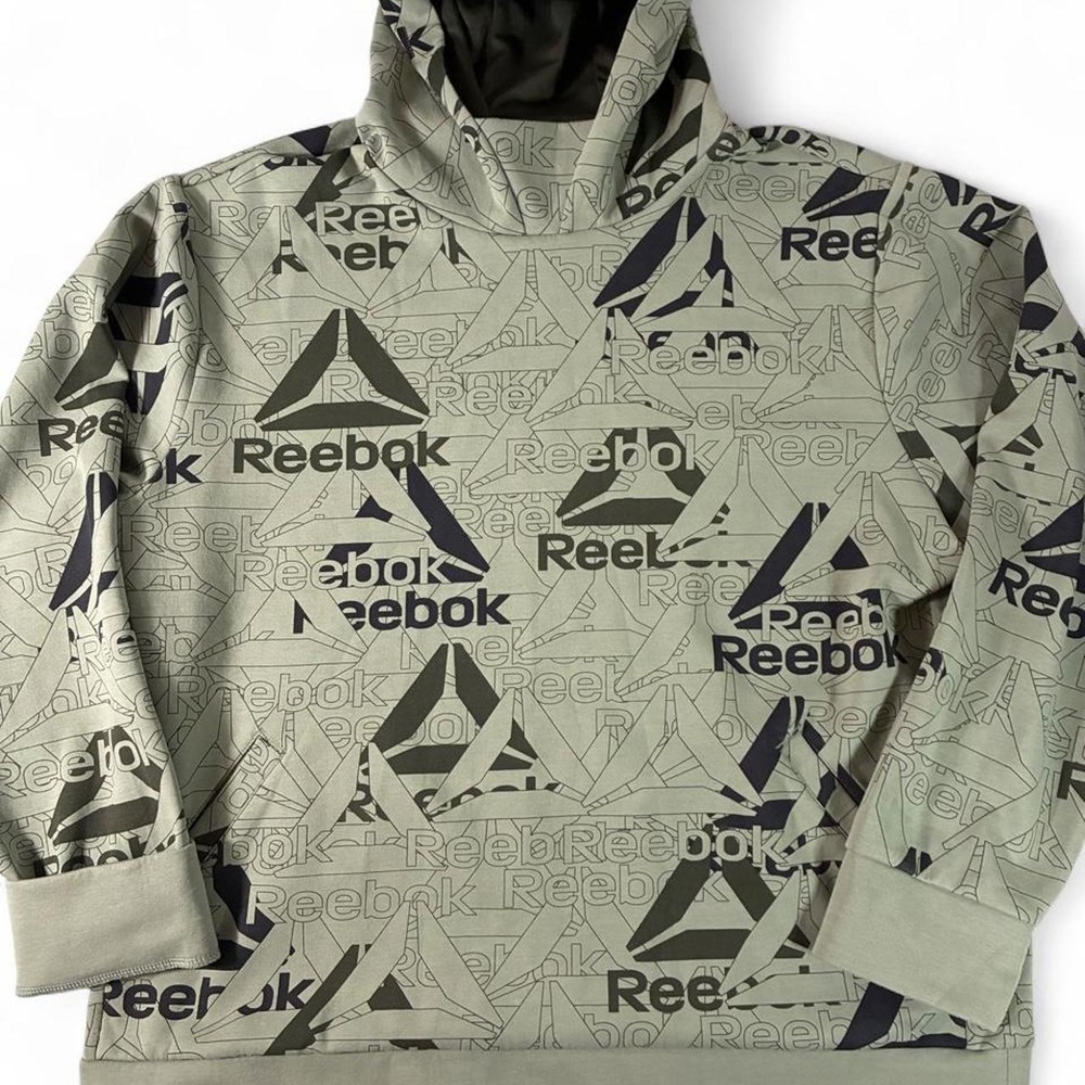 Reebok pullover hoodie with all over monogram print. Size XL